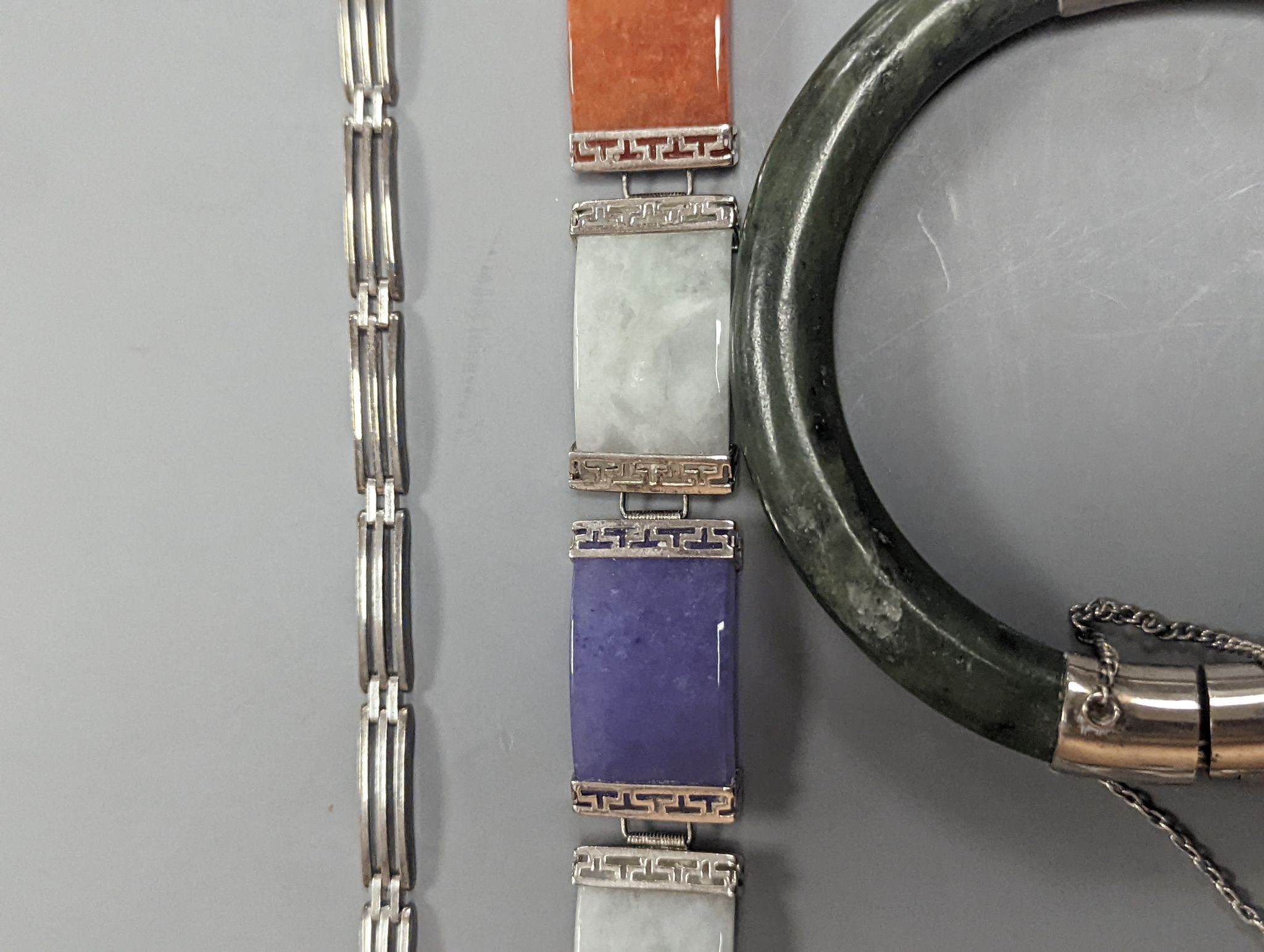 A 925 and hardstone set bracelet, 19.7cm, one other bracelet, two cameo shell brooches, three assorted bangles and a pair of sugar tongs.